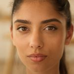 Is Abortion a Sin Confident serious calm peaceful Arabian woman looking at camera at home office indoor portrait gaze